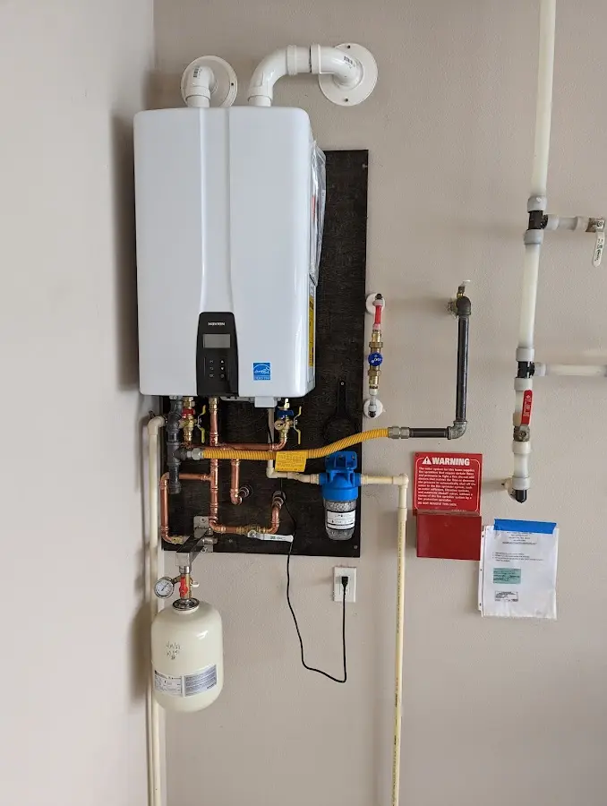 Professional plumber installing copper piping in a Lower Chanceford home